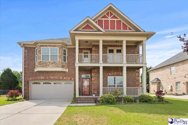 1635 Lake Wateree Dr, Florence, SC 29501 - craftsman inspired home featuring a balcony, an attached garage, driveway, a porch, and a front yard