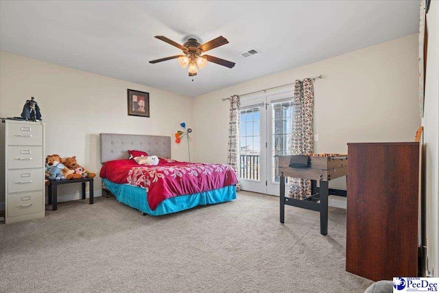 bedroom with light carpet, access to exterior, and ceiling fan