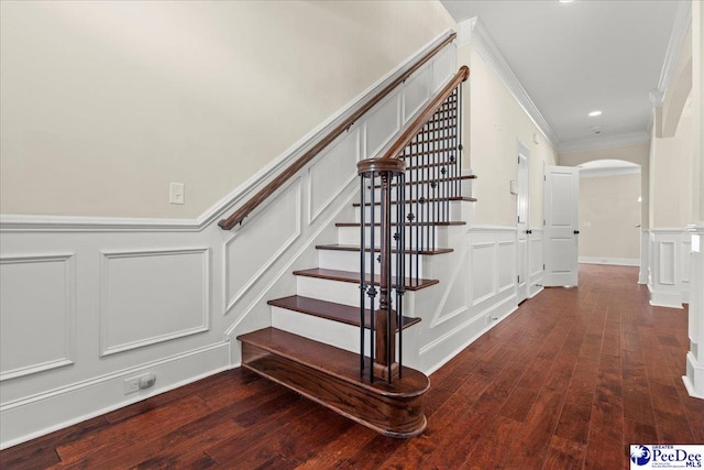 1635 Lake Wateree Dr, Florence, SC 29501 - stairway with a decorative wall, wood finished floors, arched walkways, a wainscoted wall, and ornamental molding