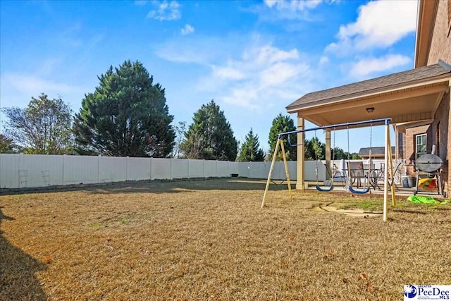 view of yard with a playground