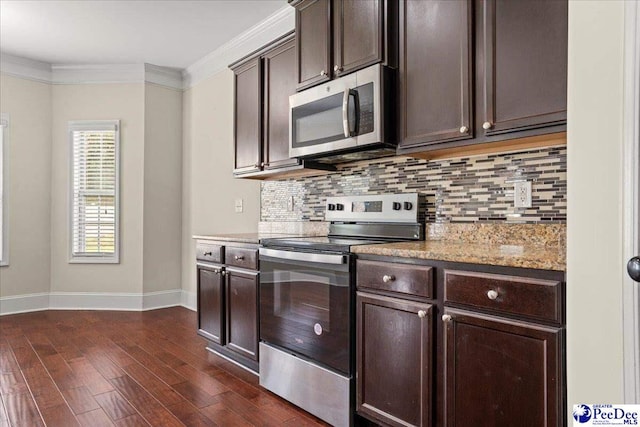 1635 Lake Wateree Dr, Florence, SC 29501 - kitchen featuring dark brown cabinets, baseboards, appliances with stainless steel finishes, and tasteful backsplash
