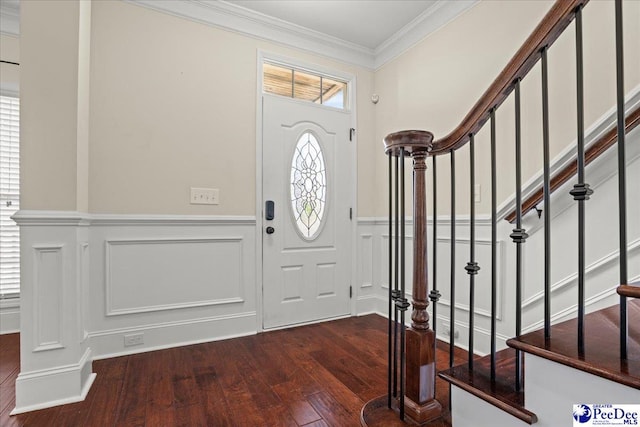 1635 Lake Wateree Dr, Florence, SC 29501 - entryway featuring ornamental molding, a decorative wall, wainscoting, stairs, and dark wood-style flooring
