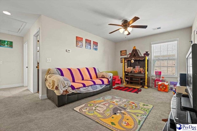 carpeted living room with ceiling fan