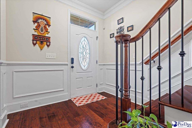 entryway with crown molding and wood-type flooring