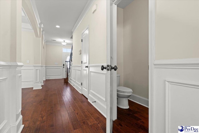 1635 Lake Wateree Dr, Florence, SC 29501 - hall featuring a wainscoted wall, dark wood-style flooring, recessed lighting, a decorative wall, and ornamental molding