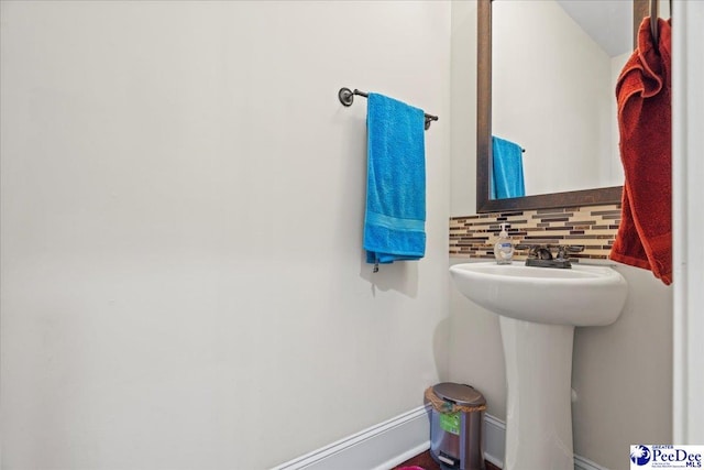 bathroom featuring tasteful backsplash