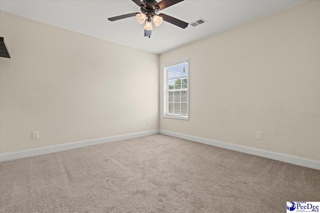 1635 Lake Wateree Dr, Florence, SC 29501 - unfurnished room with baseboards, a ceiling fan, carpet flooring, and visible vents