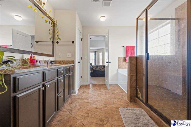 bathroom with vanity, separate shower and tub, and tile patterned floors