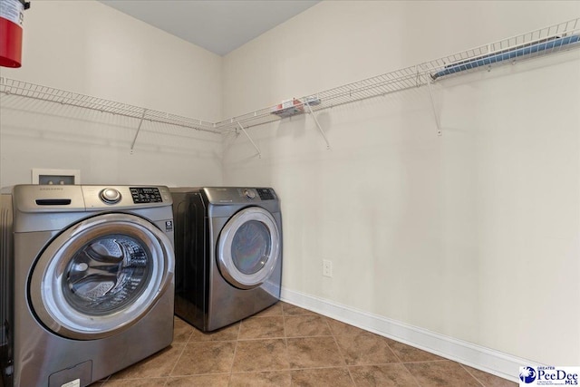 1635 Lake Wateree Dr, Florence, SC 29501 - washroom with tile patterned floors, baseboards, independent washer and dryer, and laundry area