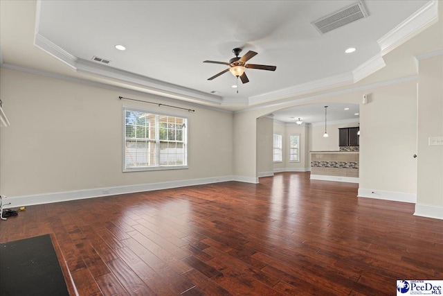 1635 Lake Wateree Dr, Florence, SC 29501 - unfurnished living room featuring arched walkways, visible vents, hardwood / wood-style flooring, and ceiling fan