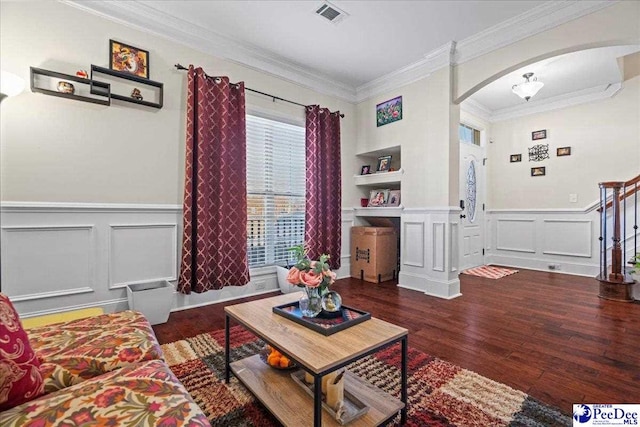 living room featuring crown molding and dark hardwood / wood-style flooring