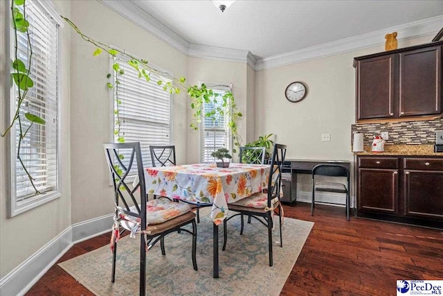 dining space with dark wood-type flooring and ornamental molding