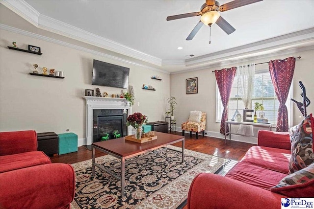 living room featuring crown molding, dark wood-type flooring, and a high end fireplace