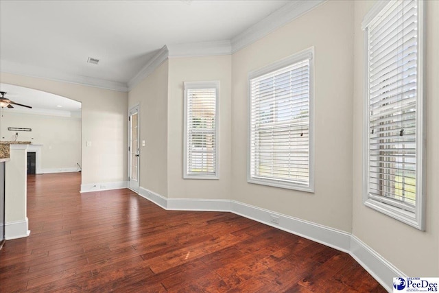 1635 Lake Wateree Dr, Florence, SC 29501 - foyer with dark wood-type flooring, visible vents, ornamental molding, and ceiling fan