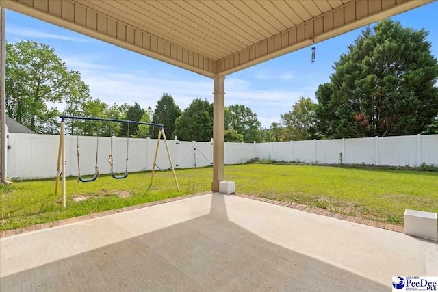 1635 Lake Wateree Dr, Florence, SC 29501 - view of patio with a fenced backyard and a playground