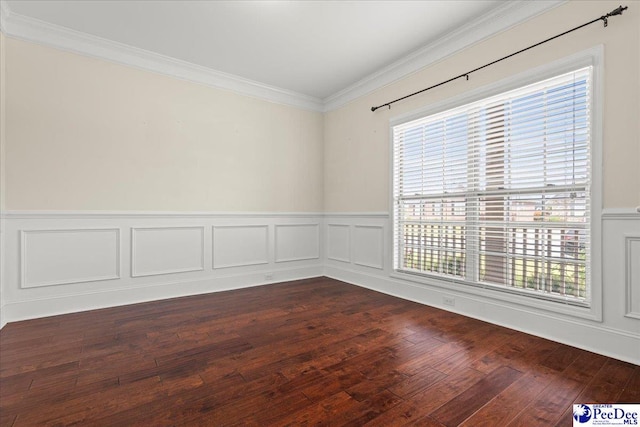 1635 Lake Wateree Dr, Florence, SC 29501 - spare room featuring wainscoting, a decorative wall, dark wood-type flooring, and crown molding
