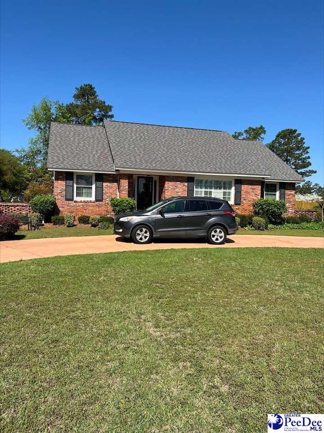 1507 Hampton Dr, Florence, SC 29505 - single story home featuring a front yard, brick siding, and driveway
