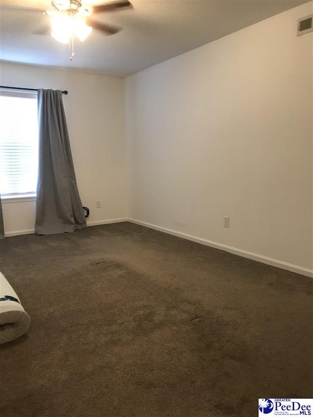 1424 Golf Terrace Blvd, Florence, SC 29501 - spare room featuring dark colored carpet and ceiling fan