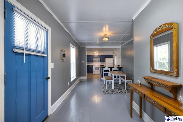 interior space with baseboards and dark wood-style floors