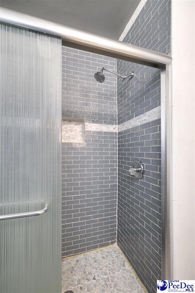 bathroom with a stall shower