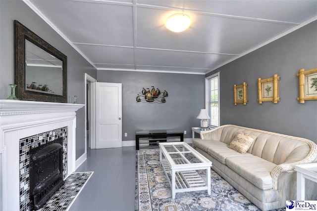 living room featuring baseboards, wood finished floors, and a fireplace