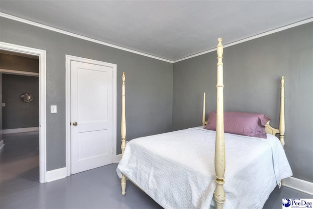 bedroom with crown molding and baseboards