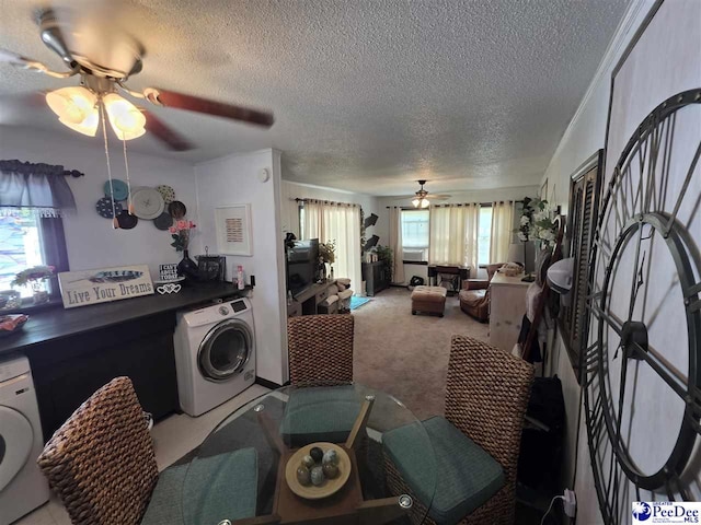 living area featuring washer / clothes dryer, a ceiling fan, a textured ceiling, and carpet