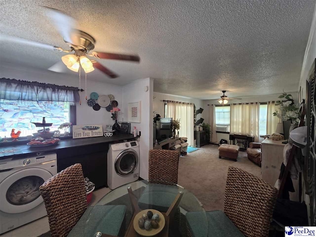 clothes washing area featuring washer / dryer, a ceiling fan, a textured ceiling, and laundry area