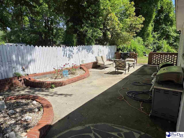 view of yard with fence and a patio