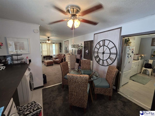 dining area featuring tile patterned floors, a textured ceiling, and a ceiling fan