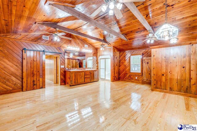 bonus room with wood ceiling, wooden walls, light hardwood / wood-style floors, and ceiling fan