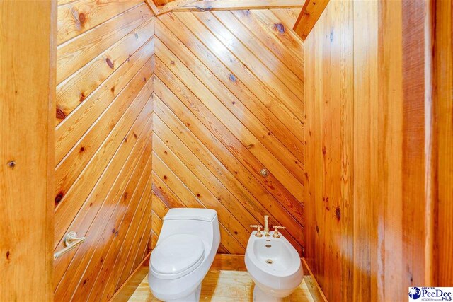 bathroom featuring a bidet and toilet