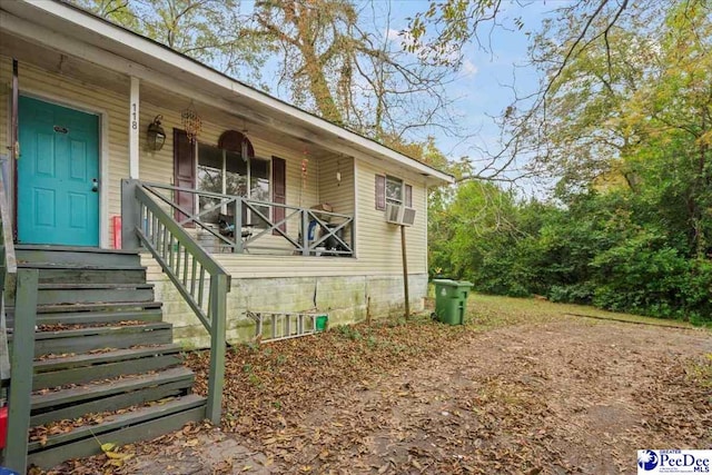 doorway to property with covered porch