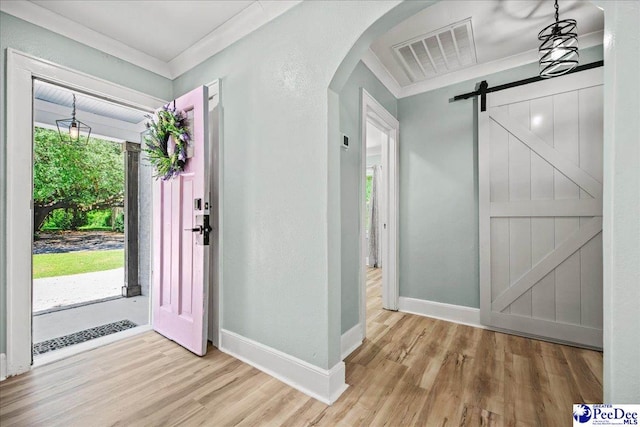 1314 Sewanee Ave, Florence, SC 29501 - foyer with healthy amount of natural light, arched walkways, wood finished floors, crown molding, and baseboards