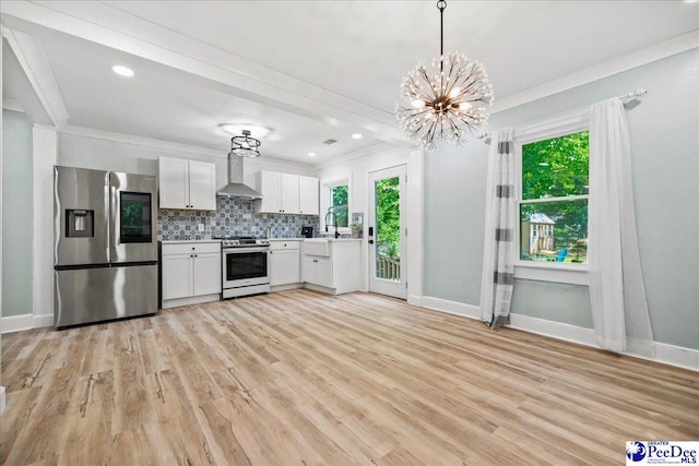 1314 Sewanee Ave, Florence, SC 29501 - kitchen featuring appliances with stainless steel finishes, wall chimney exhaust hood, light countertops, baseboards, and crown molding