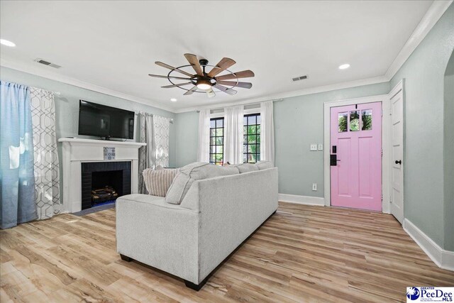 1314 Sewanee Ave, Florence, SC 29501 - living room featuring a ceiling fan, ornamental molding, baseboards, light wood-style flooring, and recessed lighting