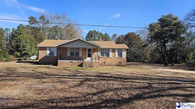 ranch-style home featuring covered porch