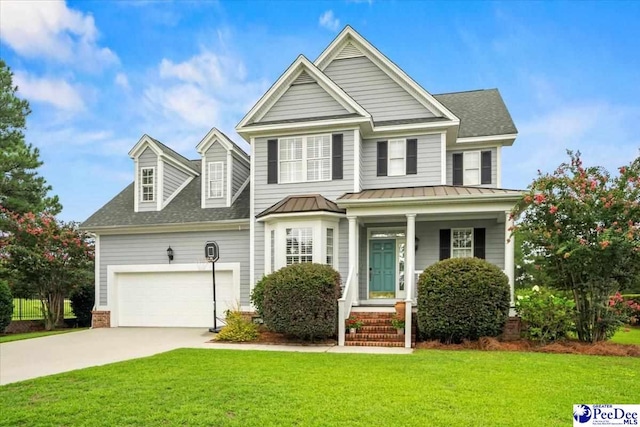 view of front facade featuring a garage and a front yard