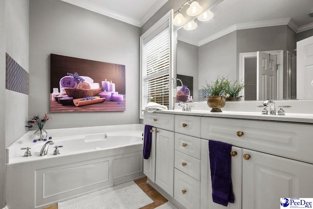 bathroom with vanity, a washtub, and ornamental molding