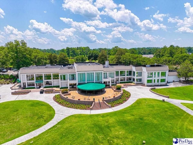 rear view of property with a lawn
