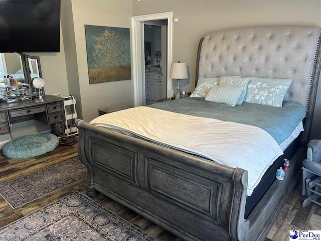 bedroom featuring dark wood-type flooring