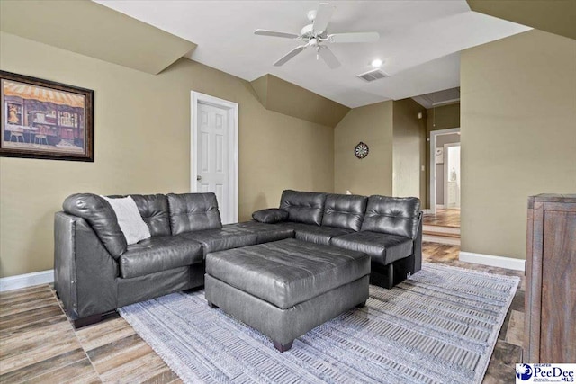 living room with vaulted ceiling, wood-type flooring, and ceiling fan