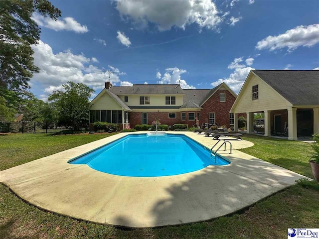 1217 Hillside Dr, Dillon, SC 29536 - outdoor pool with a patio and a sunroom