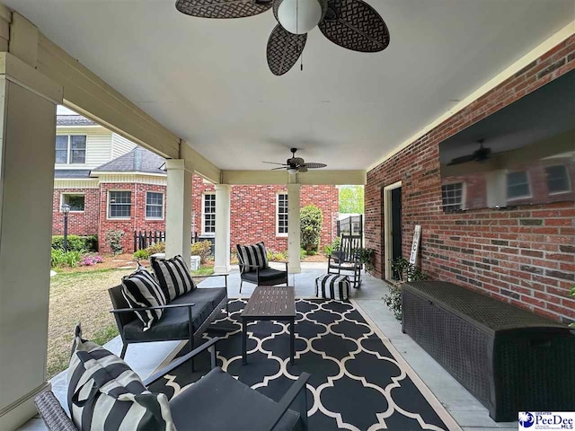 view of patio / terrace featuring a ceiling fan and outdoor lounge area