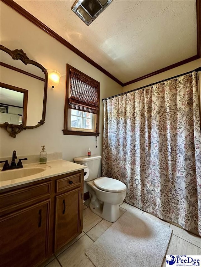 1217 Hillside Dr, Dillon, SC 29536 - full bath with toilet, vanity, a textured ceiling, crown molding, and tile patterned flooring