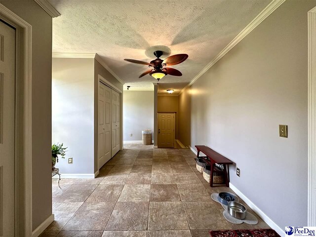 1217 Hillside Dr, Dillon, SC 29536 - corridor with baseboards, a textured ceiling, and crown molding