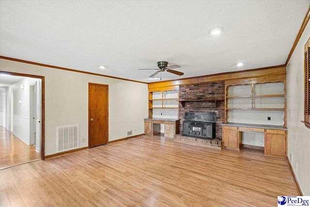 unfurnished living room with ornamental molding, a textured ceiling, ceiling fan, and light hardwood / wood-style floors