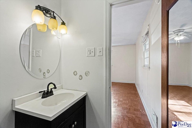 bathroom with vanity and parquet floors