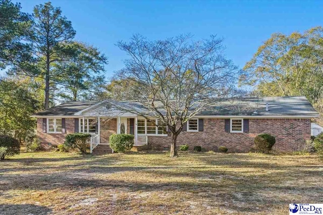 single story home featuring a front yard