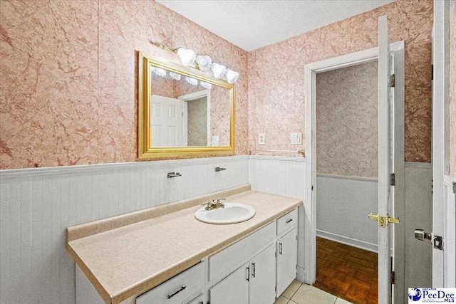 bathroom featuring vanity and a textured ceiling